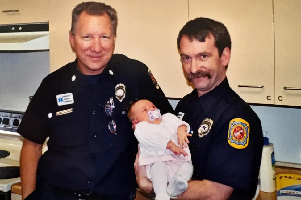 firefighter attends graduation of baby saved