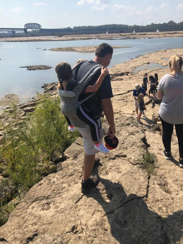 teacher carries student field trip