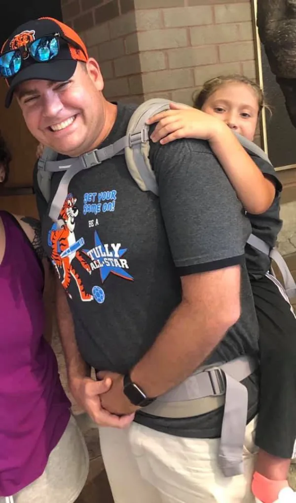 teacher carries student field trip