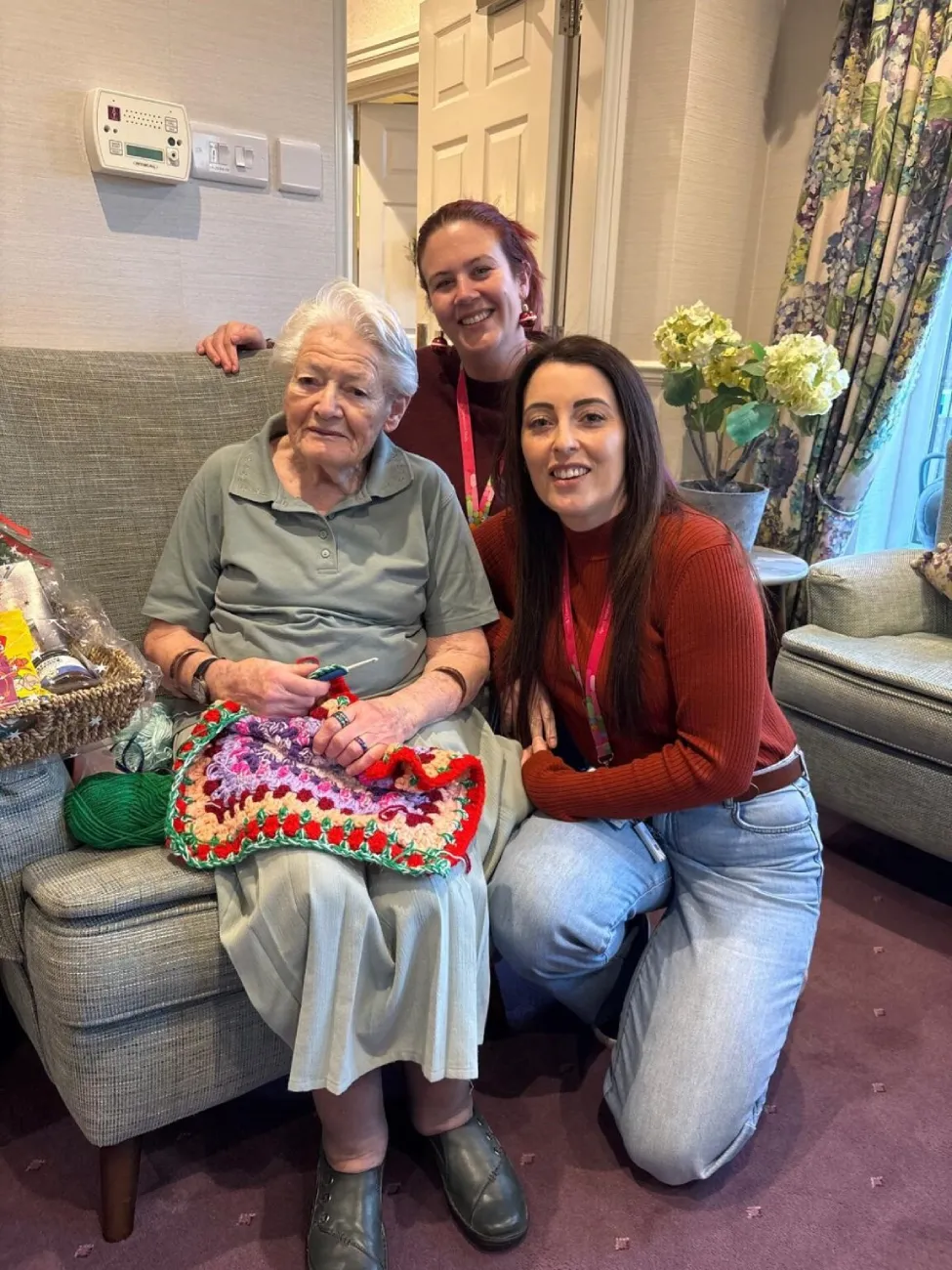 woman crochets blankets babies